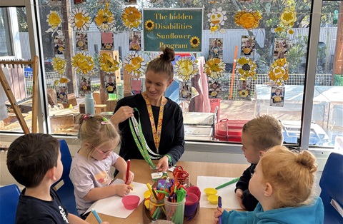 Koroit Kindergarten teacher Melissa Rowan with children.jpg