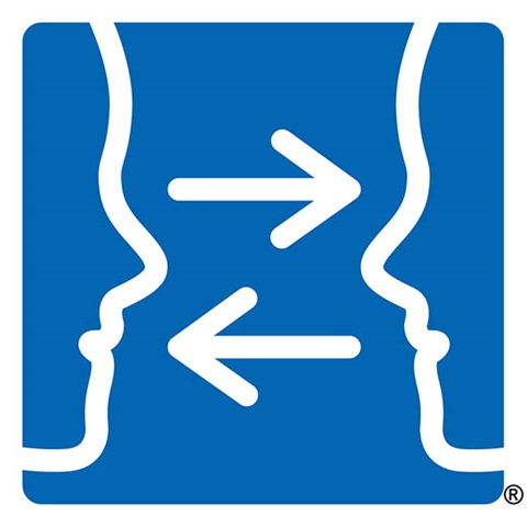 The Communication Access Symbol. Two linear drawings of faces against a blue background in profile facing each other with arrows in between them denoting two-way communication.
