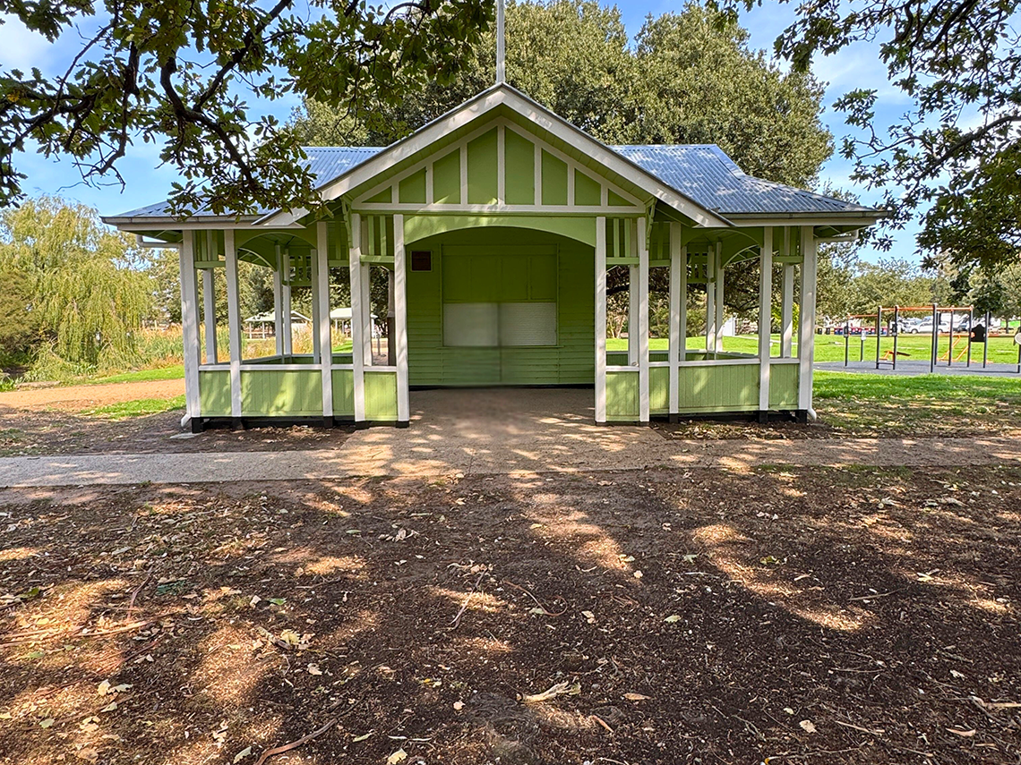 Exterior view of the pavillion in the shade of oak trees